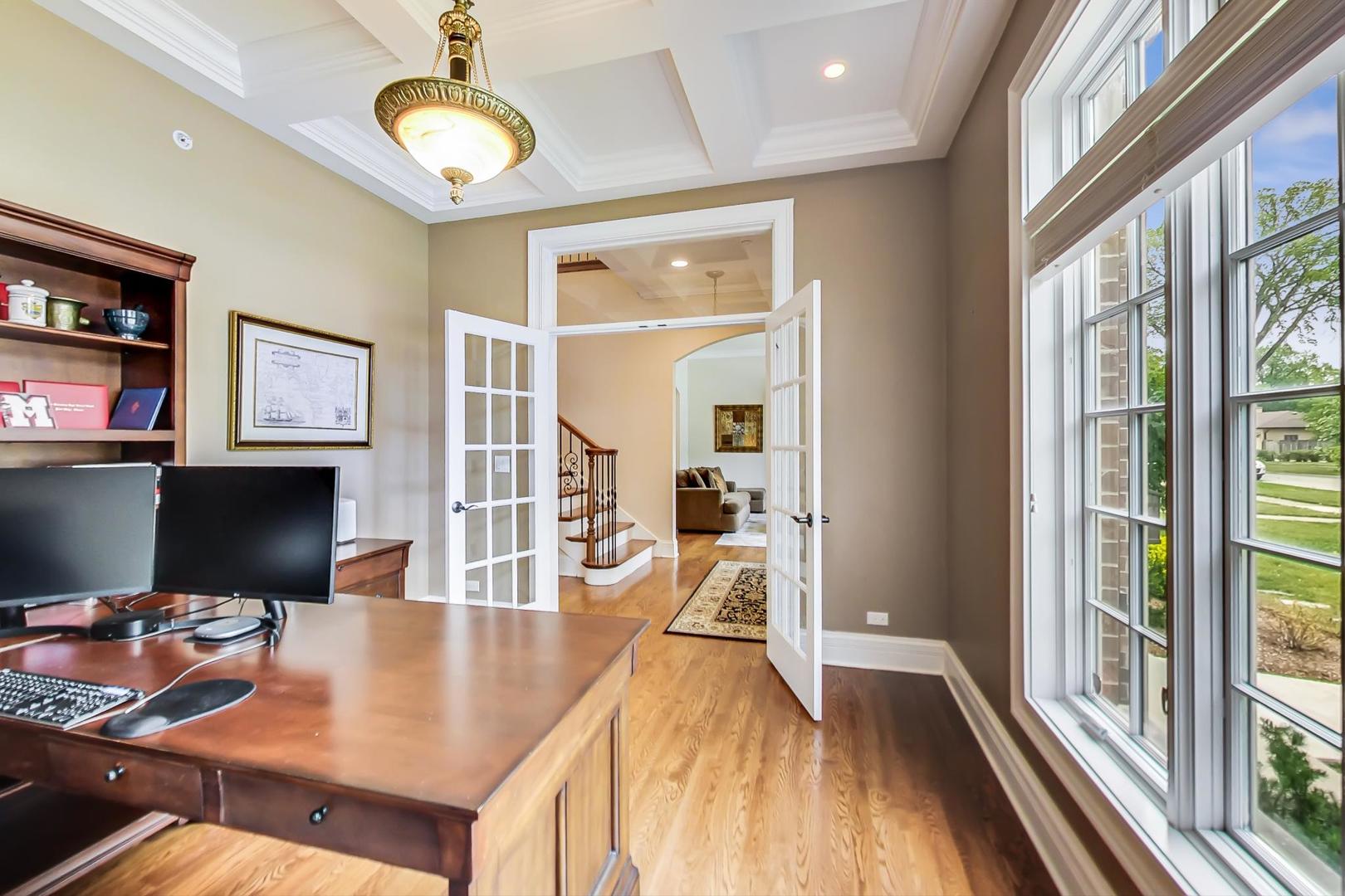 827 South Chester Avenue Park Ridge, IL 60068 - Photo 14 of 38 a view of a dining room with furniture a chandelier and wooden floor