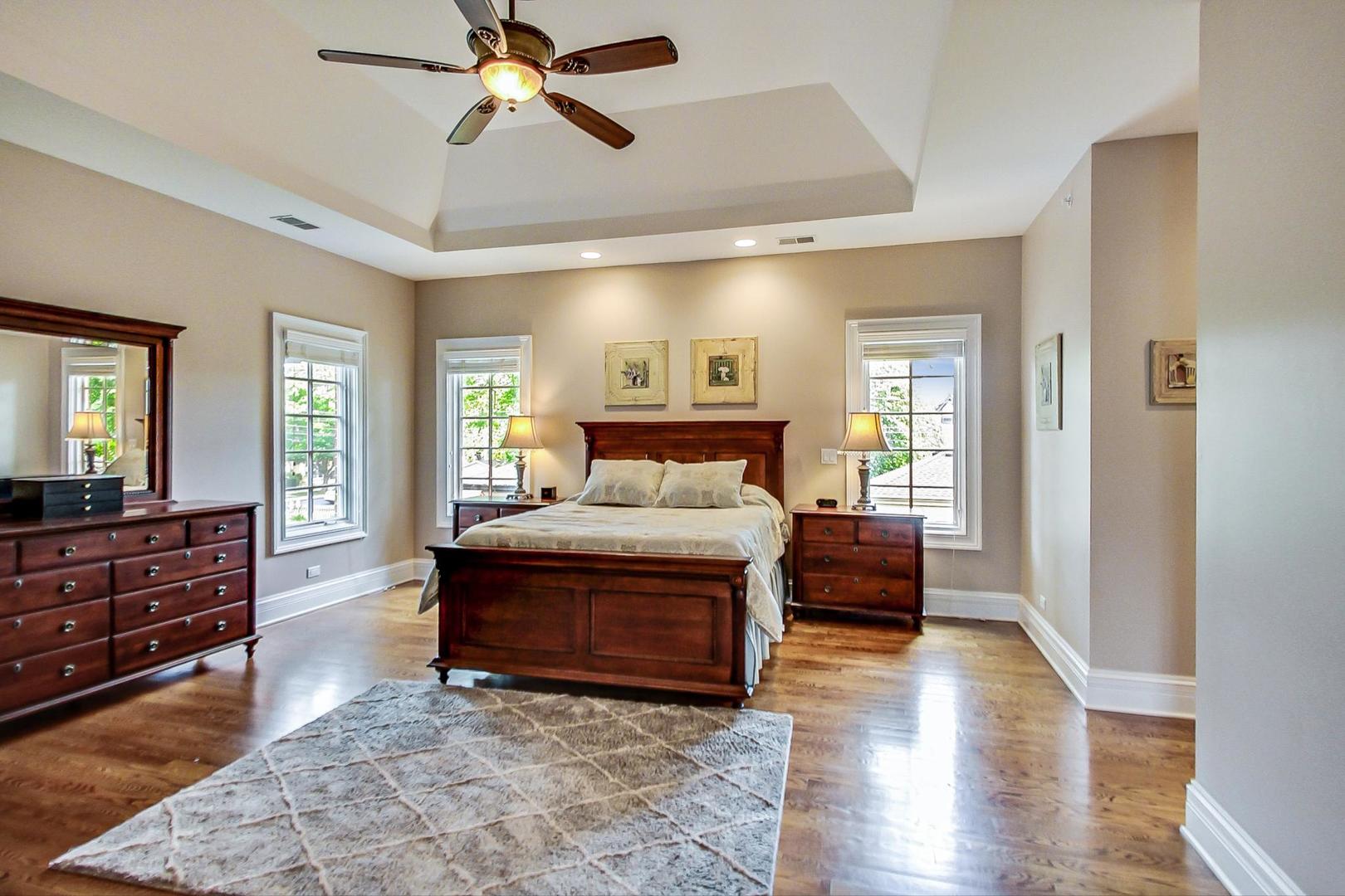 827 South Chester Avenue Park Ridge, IL 60068 - Photo 18 of 38 a spacious bedroom with a bed and wooden floor