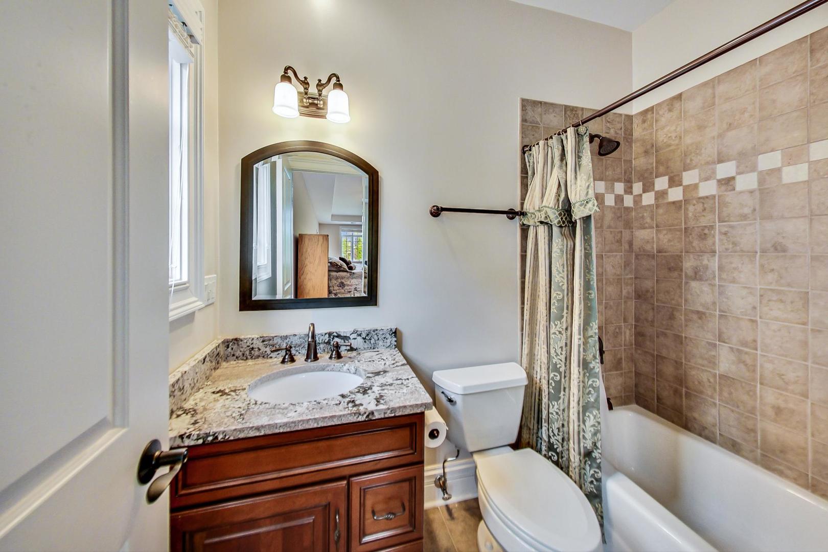 827 South Chester Avenue Park Ridge, IL 60068 - Photo 22 of 38 a bathroom with a sink a toilet and shower