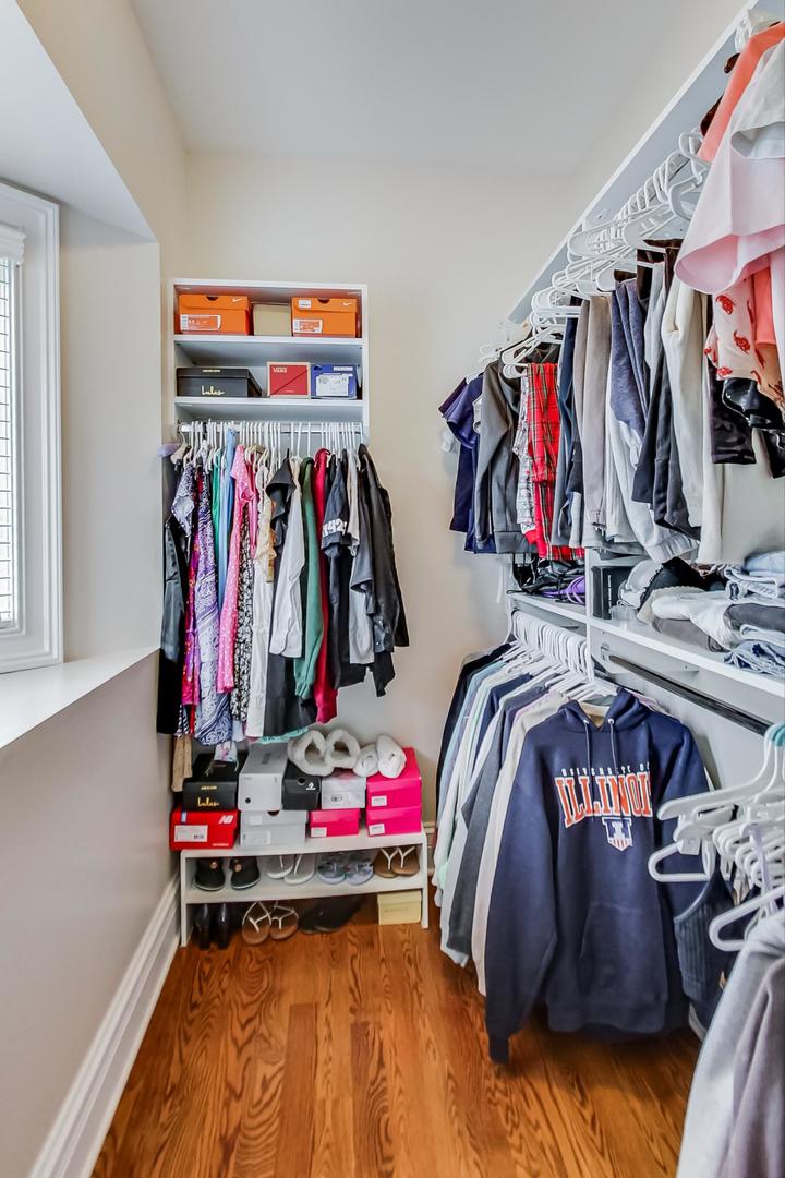 827 South Chester Avenue Park Ridge, IL 60068 - Photo 24 of 38 a view of walk in closet with clothes and shoes
