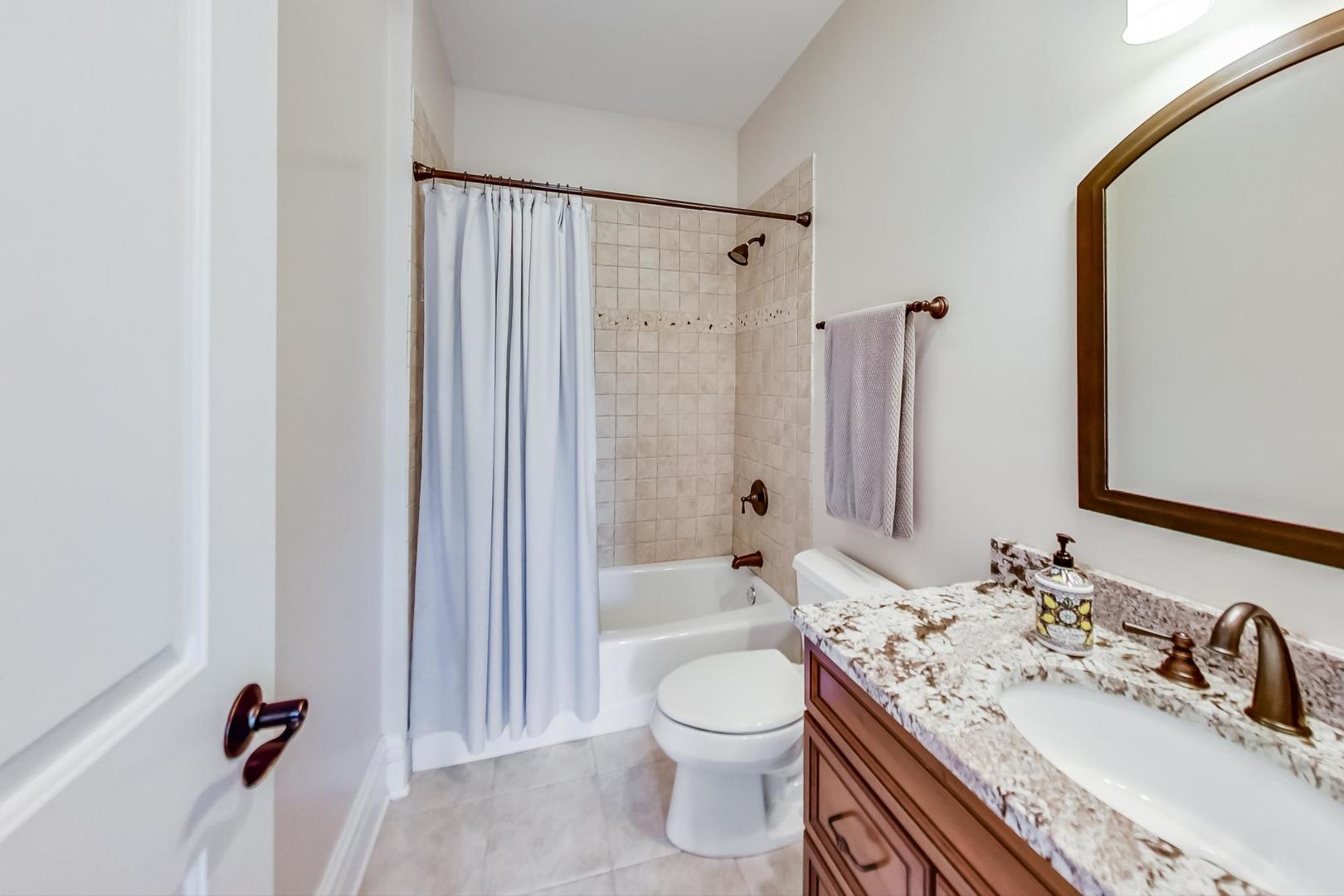 827 South Chester Avenue Park Ridge, IL 60068 - Photo 25 of 38 a bathroom with a granite countertop sink toilet and shower