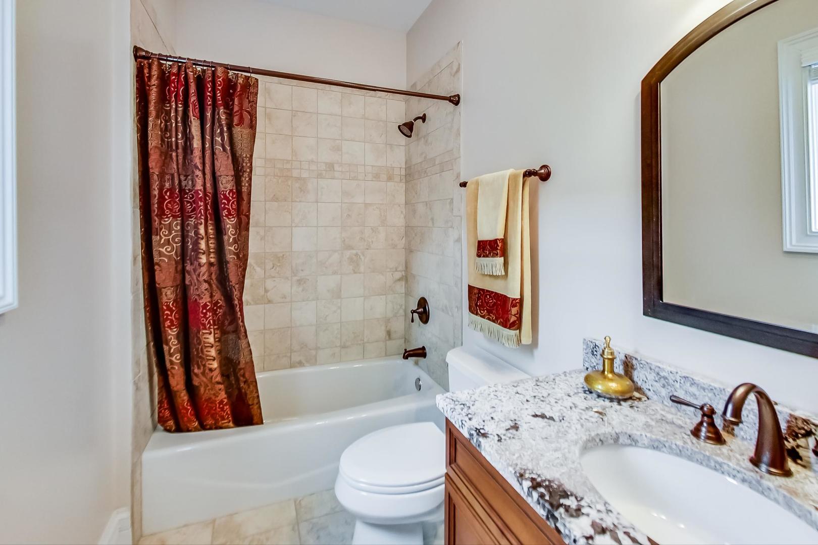 827 South Chester Avenue Park Ridge, IL 60068 - Photo 27 of 38 a bathroom with a sink a toilet and shower