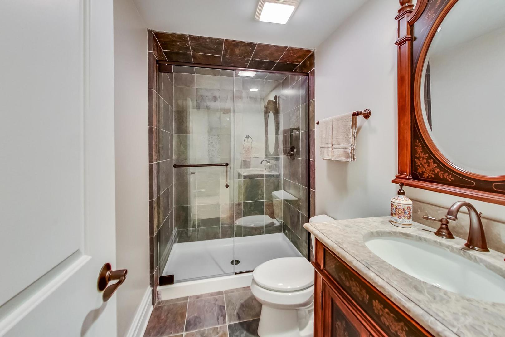 827 South Chester Avenue Park Ridge, IL 60068 - Photo 33 of 38 a bathroom with a granite countertop sink toilet and shower