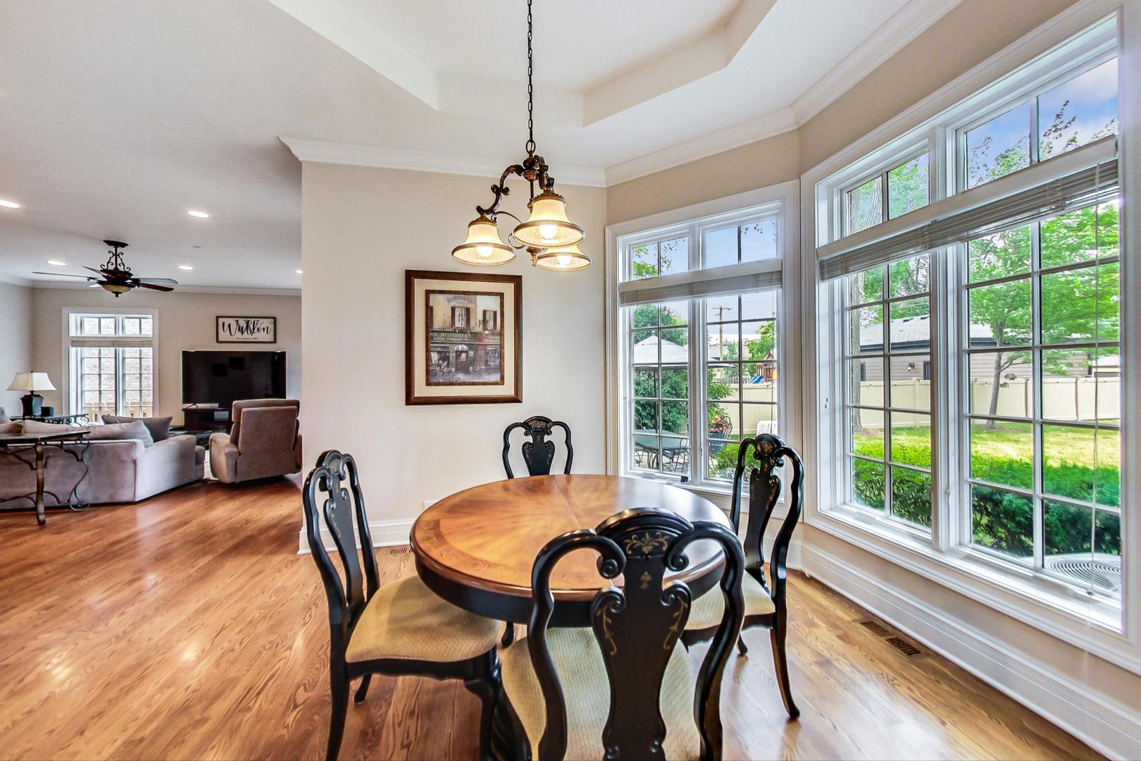 827 South Chester Avenue Park Ridge, IL 60068 - Photo 9 of 38 a view of a dining room with furniture large windows and wooden floor