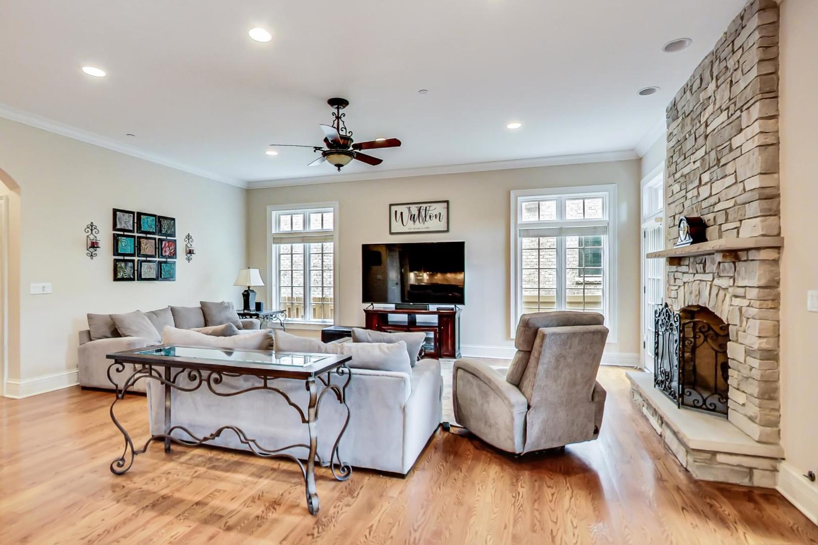 827 South Chester Avenue Park Ridge, IL 60068 - Photo 10 of 38 a living room with furniture and a fireplace