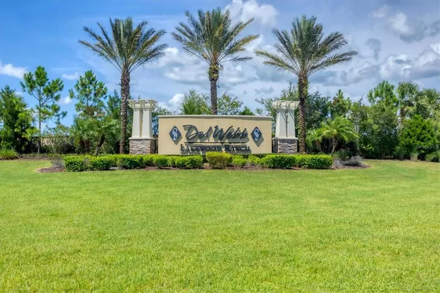 a very nice looking living room with a large window and flat screen tv