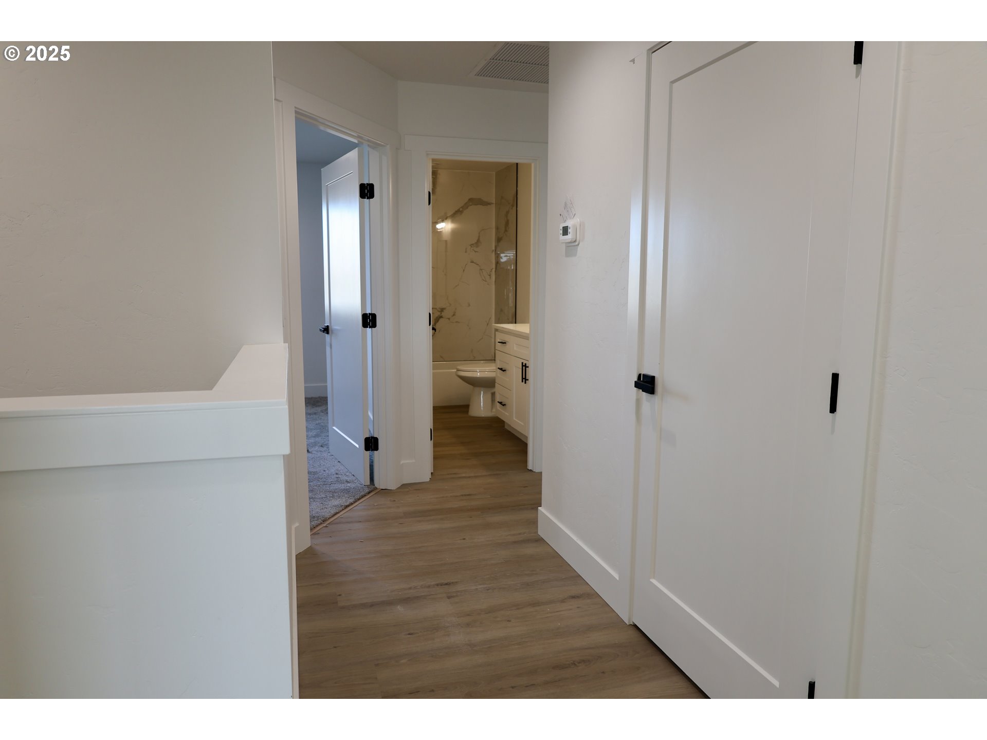 1750 Northeast 8th Place Hermiston, OR 97838 - Photo 14 of 21 a view of a hallway with wooden floor
