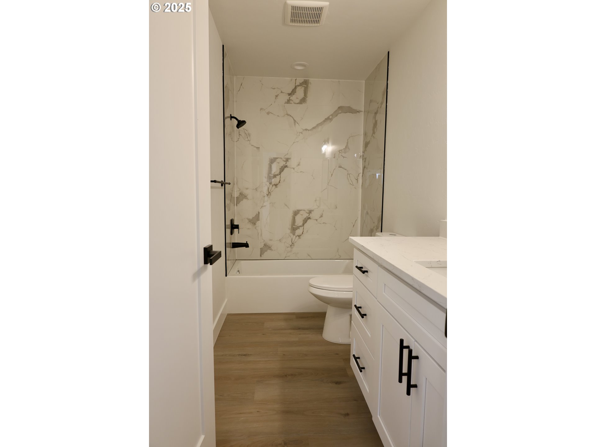 1750 Northeast 8th Place Hermiston, OR 97838 - Photo 15 of 21 a bathroom with a double vanity sink toilet mirror and shower