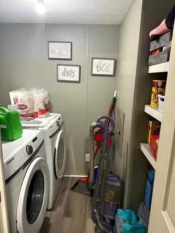 a view of a storage & utility room with washer and dryer