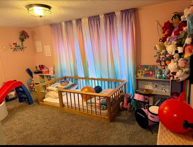 a bedroom with furniture and a lamp