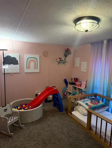 a living room with furniture and a table