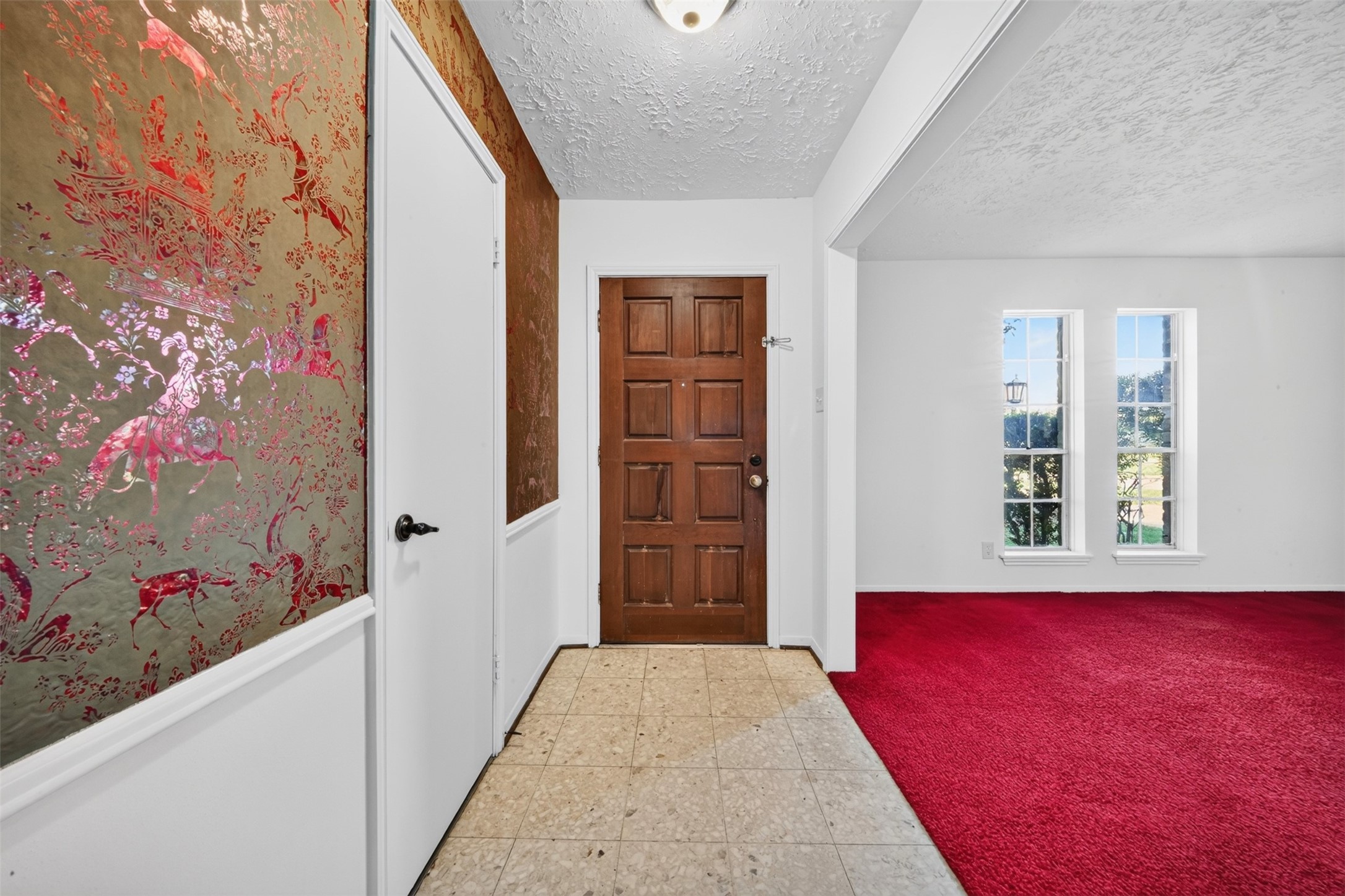 2214 Millhouse Road Houston, TX 77073 - Photo 3 of 20 Front door entrance with coat closet and entrance to a room that can be used as Formal living area or dining room