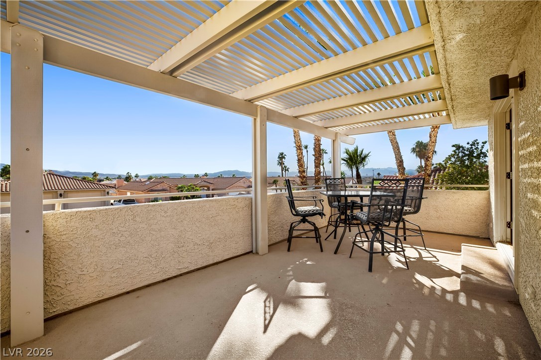 1135 Calico Ridge Drive Henderson, NV 89011 - Photo 37 of 86 An inviting covered patio offers picturesque views of the Las Vegas Strip, mountains and the neighborhood.