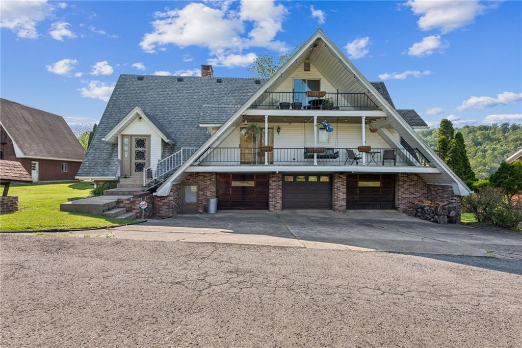 375 Reduction Road Smithton, PA 15479 - Photo 10 of 30 a front view of a house with a yard and garage