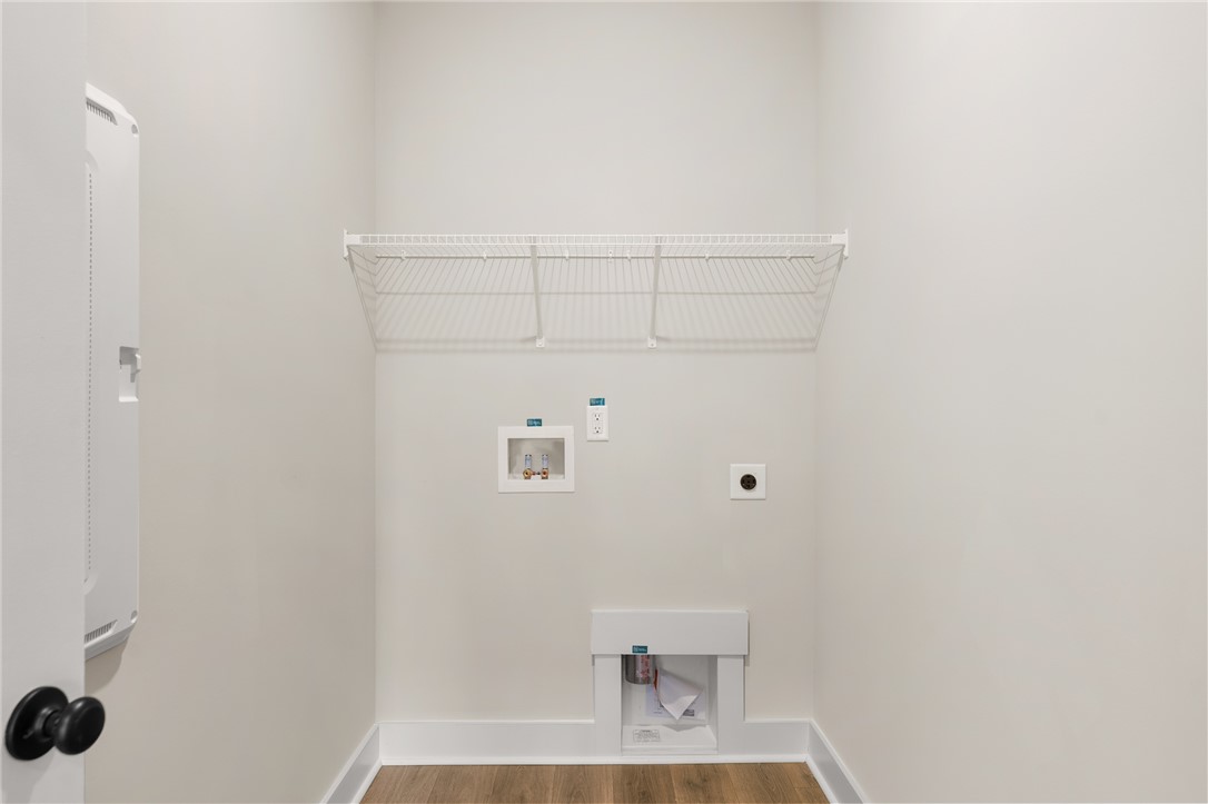 334 Summerall Drive Anderson, SC 29621 - Photo 7 of 28 This dedicated laundry space offers practical design and efficient utility connections.