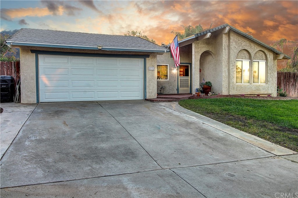 2772 Kathleen Street Riverside, CA 92506 - Photo 1 of 1 a front view of a house with a yard and garage