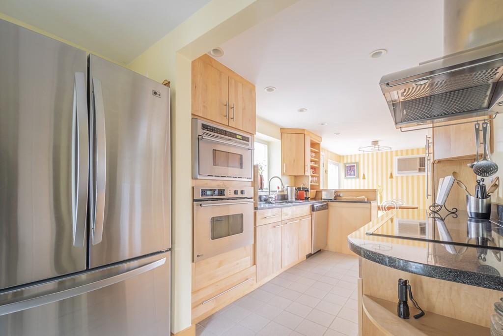 2 Great Rock Road Lexington, MA 02421 - Photo 13 of 42 a kitchen with stainless steel appliances granite countertop a refrigerator a stove and a sink