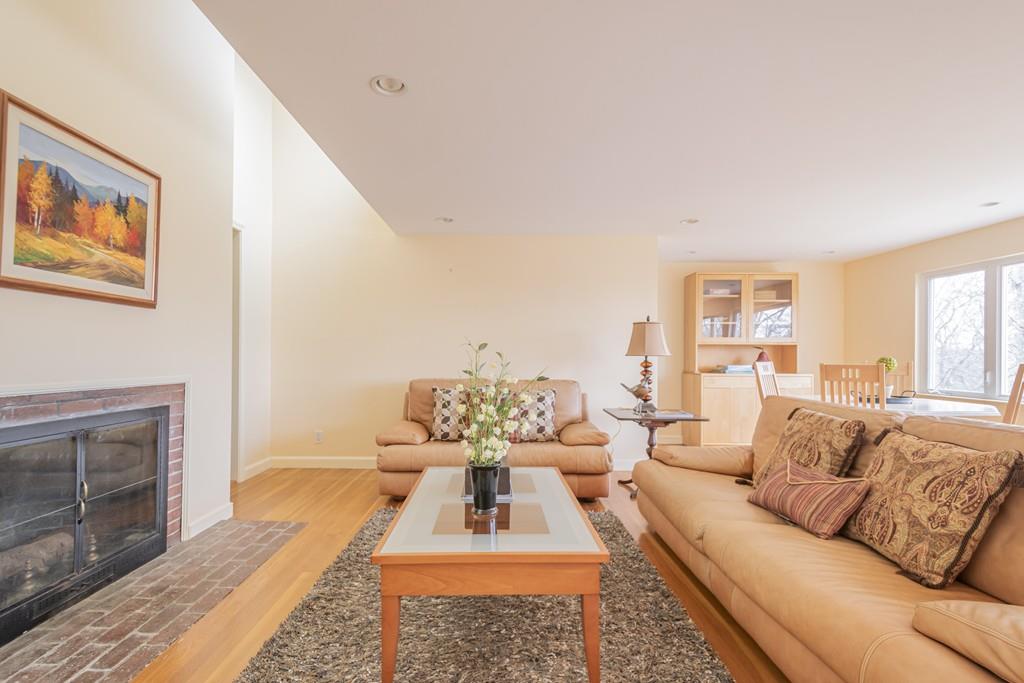 2 Great Rock Road Lexington, MA 02421 - Photo 20 of 42 a living room with furniture a fireplace and a flat screen tv