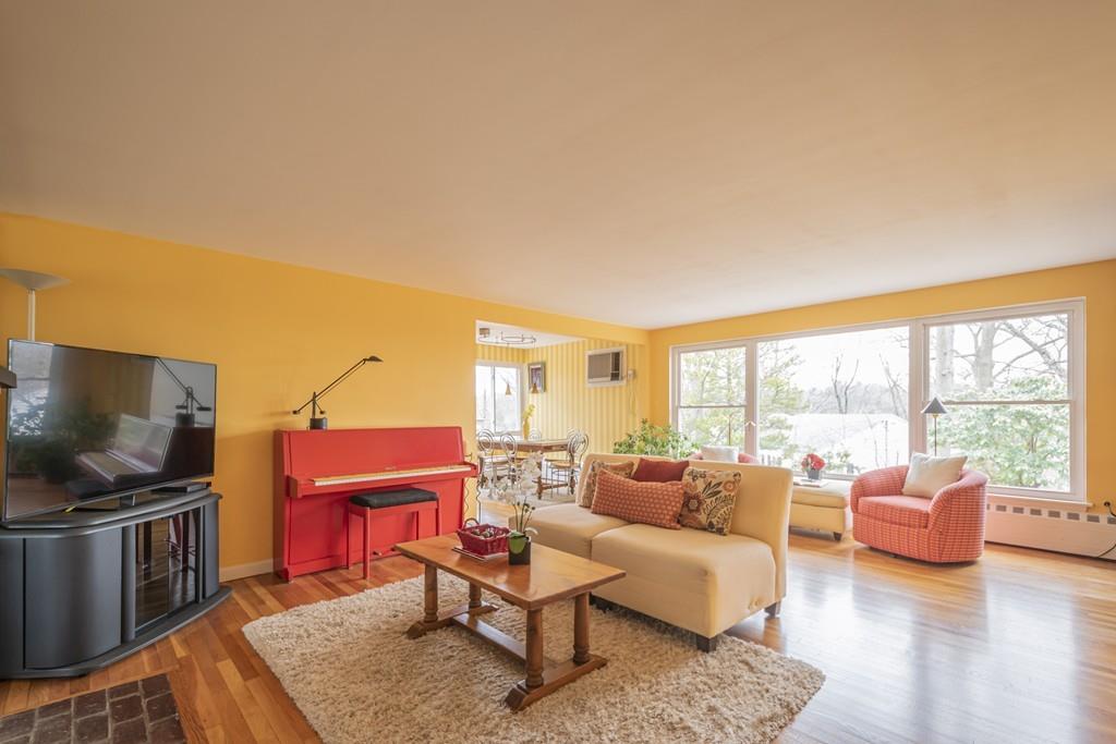 2 Great Rock Road Lexington, MA 02421 - Photo 2 of 42 a living room with furniture a large window and a flat screen tv