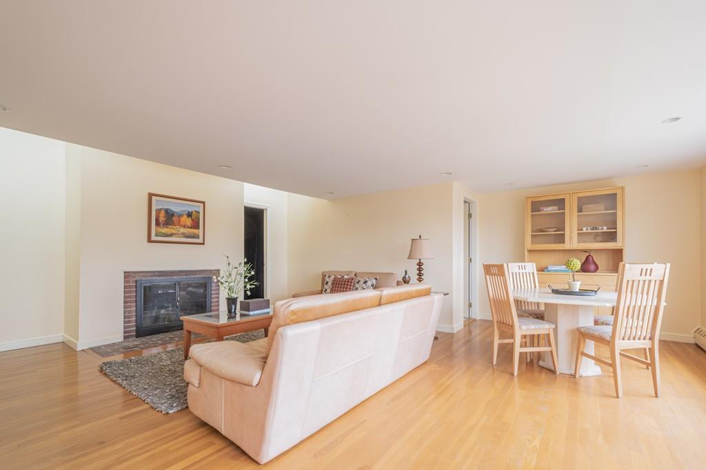 2 Great Rock Road Lexington, MA 02421 - Photo 21 of 42 a living room with furniture a fireplace and a table