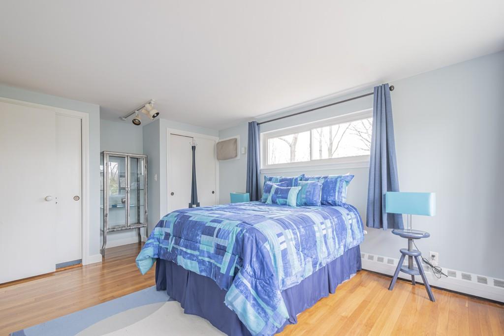 2 Great Rock Road Lexington, MA 02421 - Photo 39 of 42 a bedroom with a bed and wooden floor