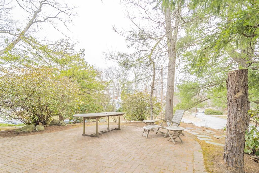2 Great Rock Road Lexington, MA 02421 - Photo 42 of 42 a roof deck with table and chairs under an umbrella