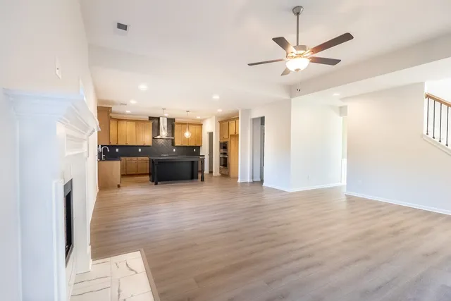 a view of a kitchen with a sink and a refrigerator