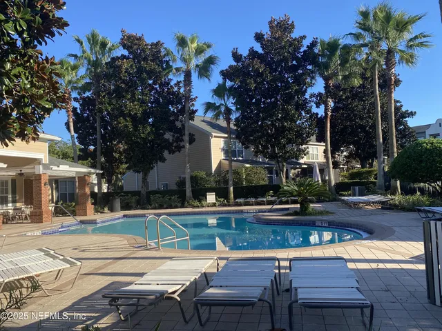 a view of a yard with furniture
