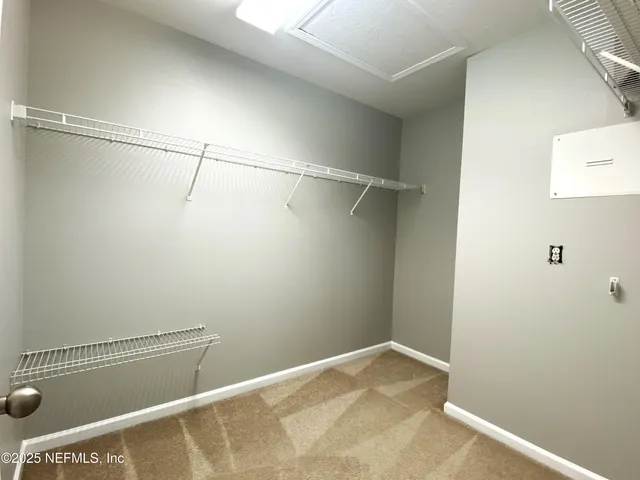 a view of a room with racks on the wall