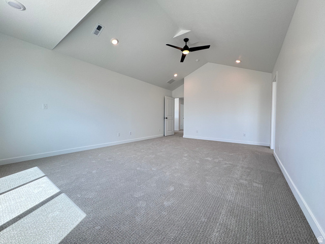 2633 Scarlet Road, Unit 259 Eagle Mountain, UT 84005 - Photo 17 of 30 Spacious room with vaulted ceilings, recessed lighting, a ceiling fan, and light gray carpet flooring