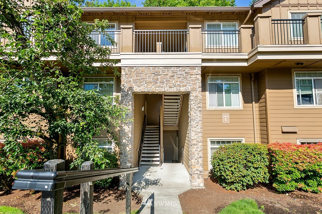 18930 Bothell Everett Highway, Unit C303 Bothell, WA 98012 - Photo 1 of 12 front view of a house
