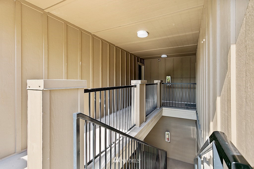 18930 Bothell Everett Highway, Unit C303 Bothell, WA 98012 - Photo 4 of 12 a view of entryway with wooden floor