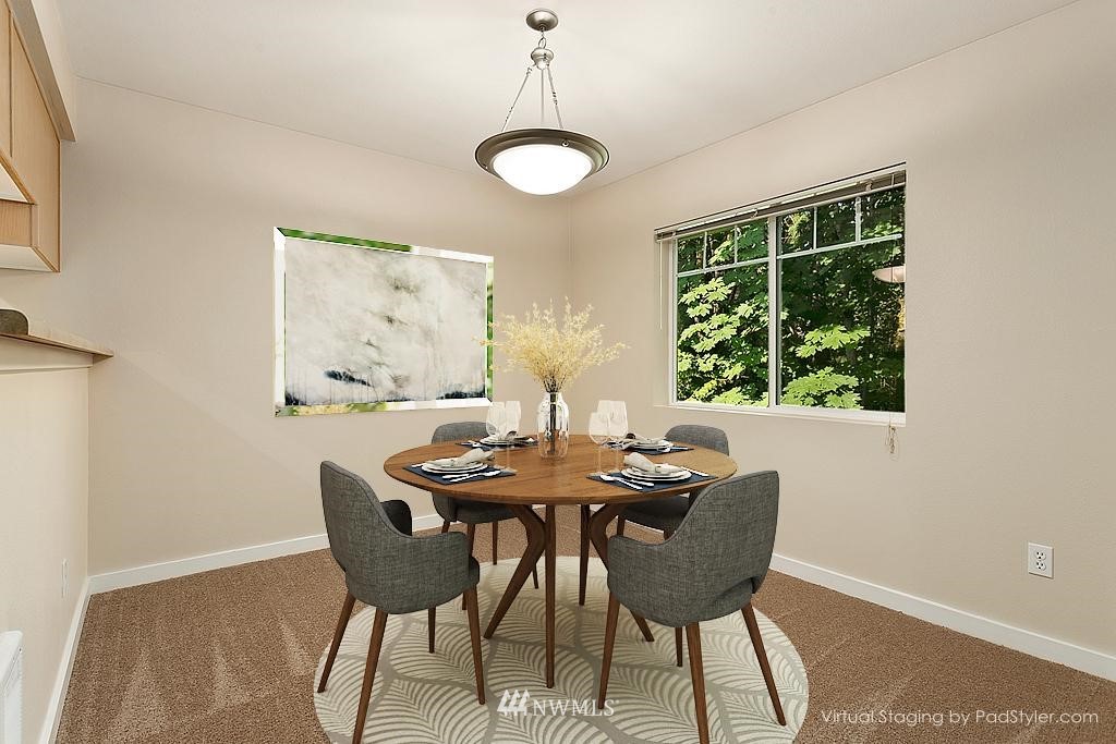 18930 Bothell Everett Highway, Unit C303 Bothell, WA 98012 - Photo 7 of 12 a view of a dining room with furniture window and outside view
