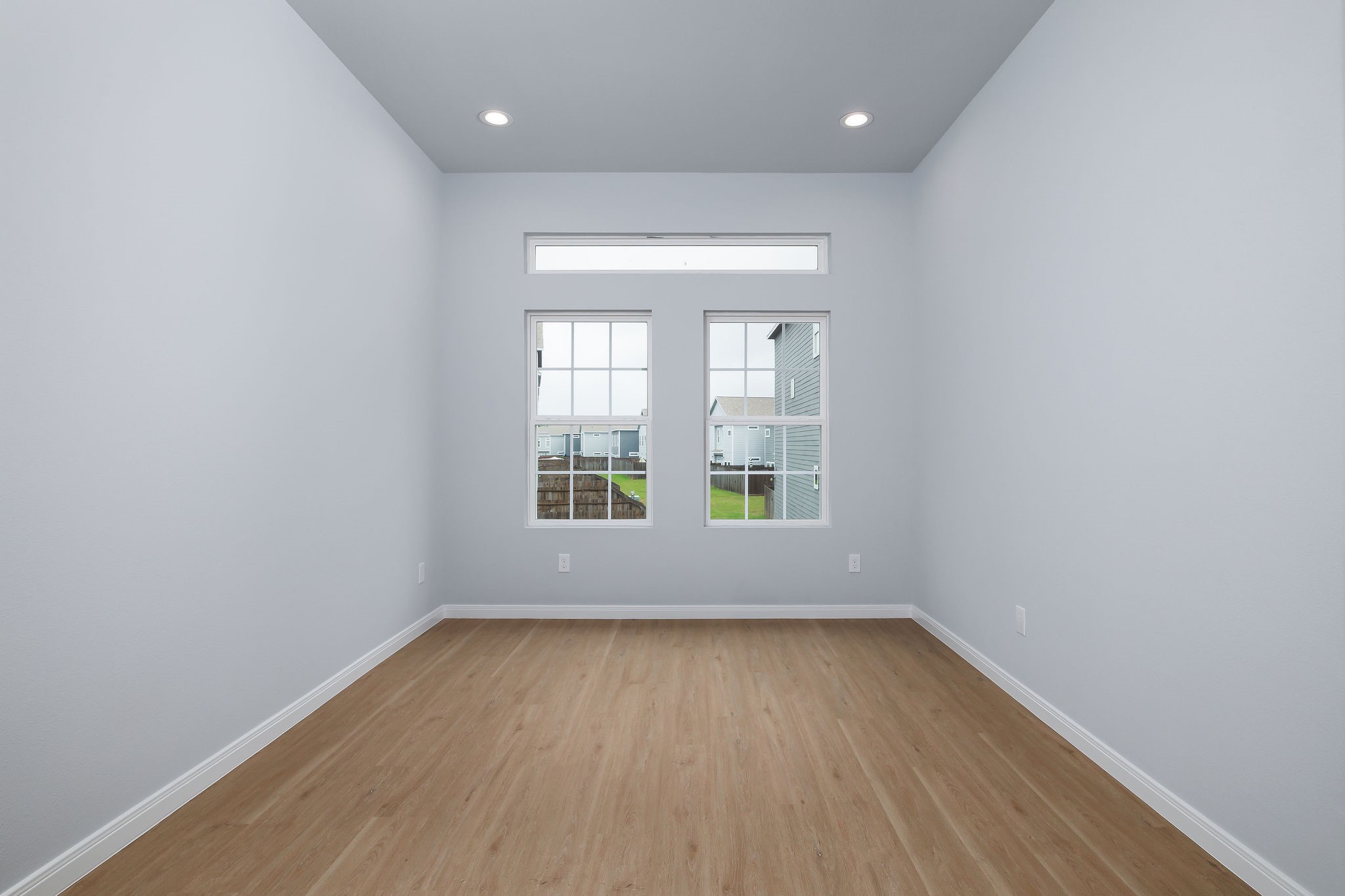 18834 Elegance Ave Spring Spring, TX 77379 - Photo 12 of 19 wooden floor in an empty room with a window