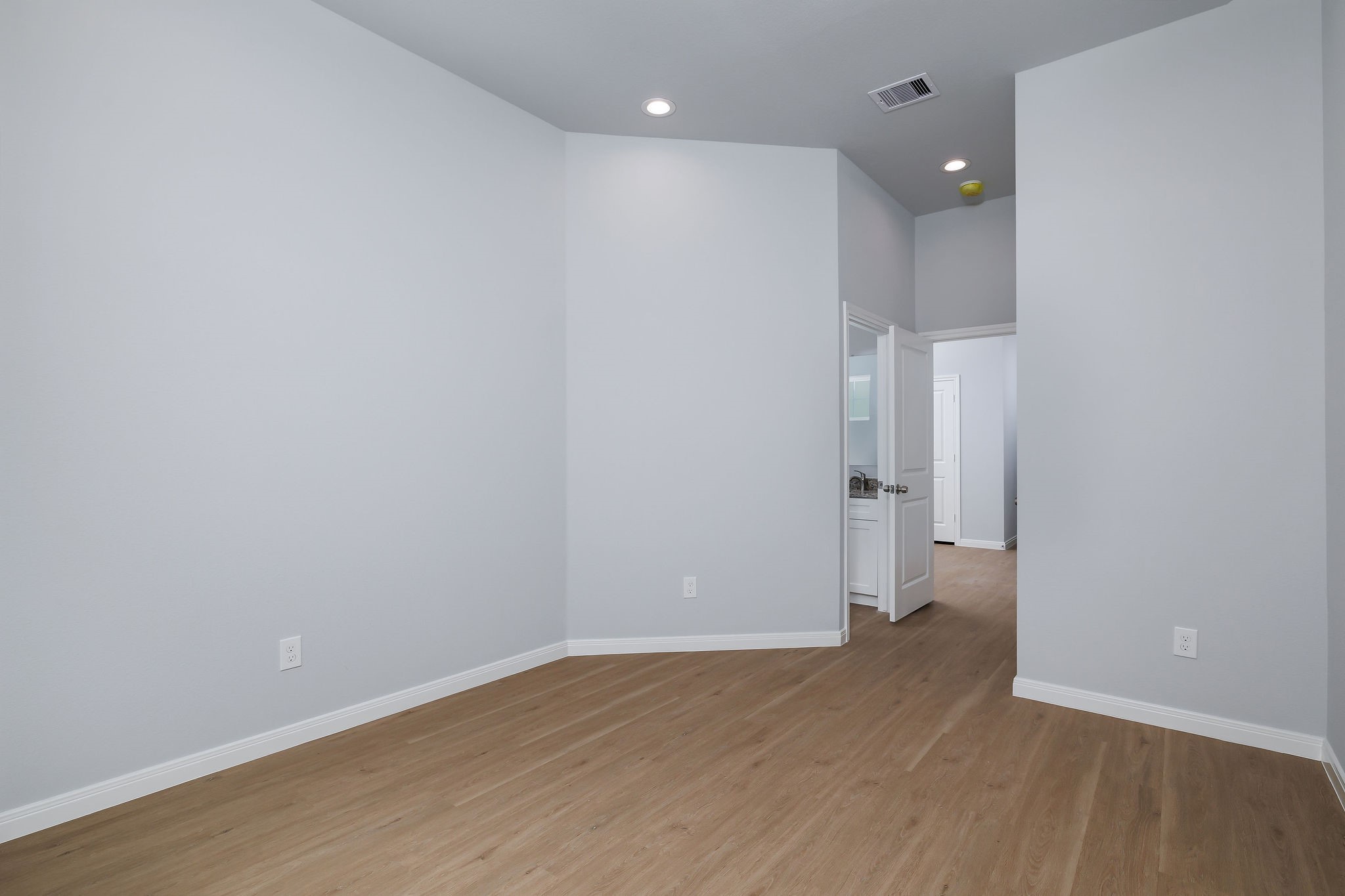 18834 Elegance Ave Spring Spring, TX 77379 - Photo 13 of 19 a view of empty room with wooden floor