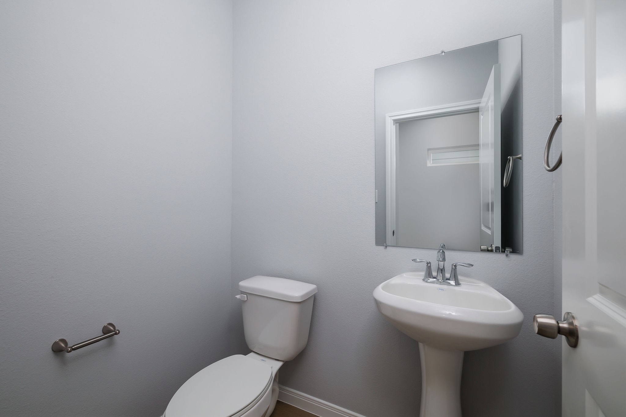18834 Elegance Ave Spring Spring, TX 77379 - Photo 9 of 19 a bathroom with a toilet sink and mirror