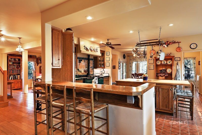 36285 Tool Road Mountain Center, CA 92561 - Photo 16 of 47 a kitchen with stainless steel appliances a sink and a refrigerator