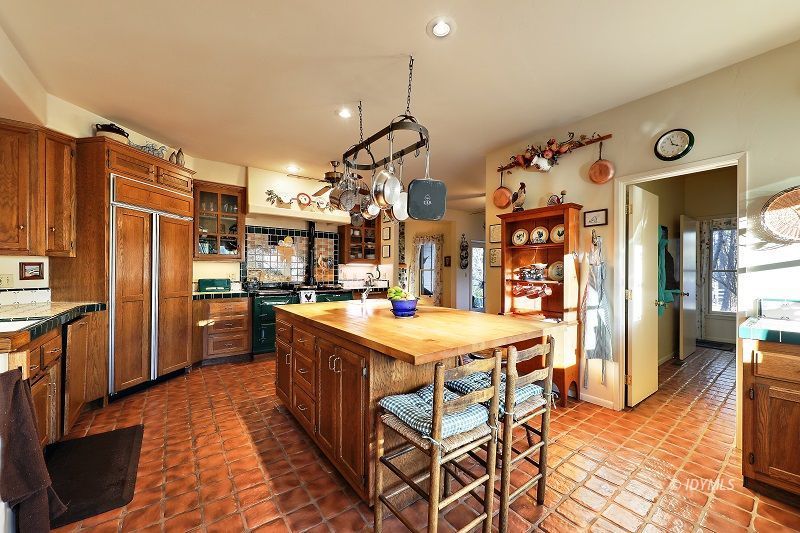 36285 Tool Road Mountain Center, CA 92561 - Photo 17 of 47 a kitchen with refrigerator and cabinets