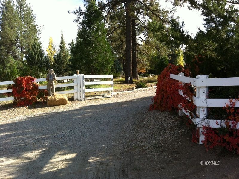 36285 Tool Road Mountain Center, CA 92561 - Photo 2 of 47 a view of a patio with table and chairs a fire pit and a couple of trees