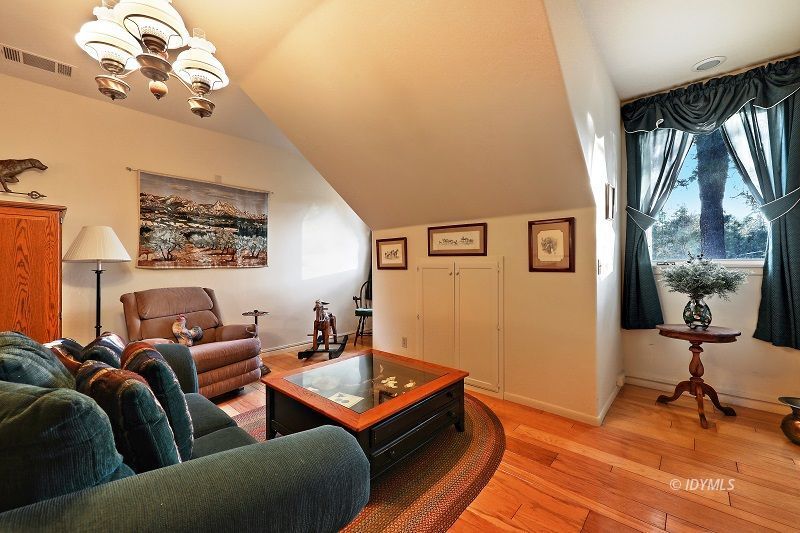 36285 Tool Road Mountain Center, CA 92561 - Photo 23 of 47 a living room with furniture a window and a chandelier