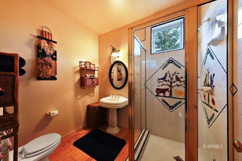 36285 Tool Road Mountain Center, CA 92561 - Photo 27 of 47 a bathroom with a toilet and a shower curtain