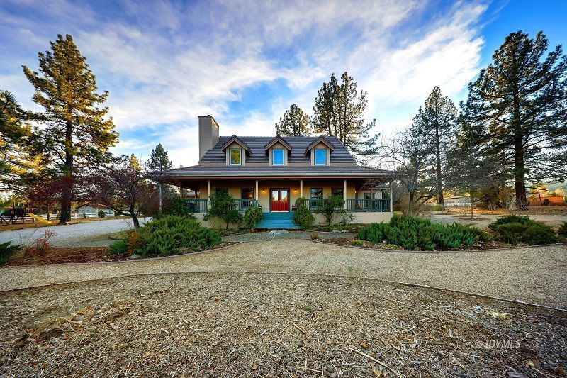 36285 Tool Road Mountain Center, CA 92561 - Photo 9 of 47 a front view of a house with a garden