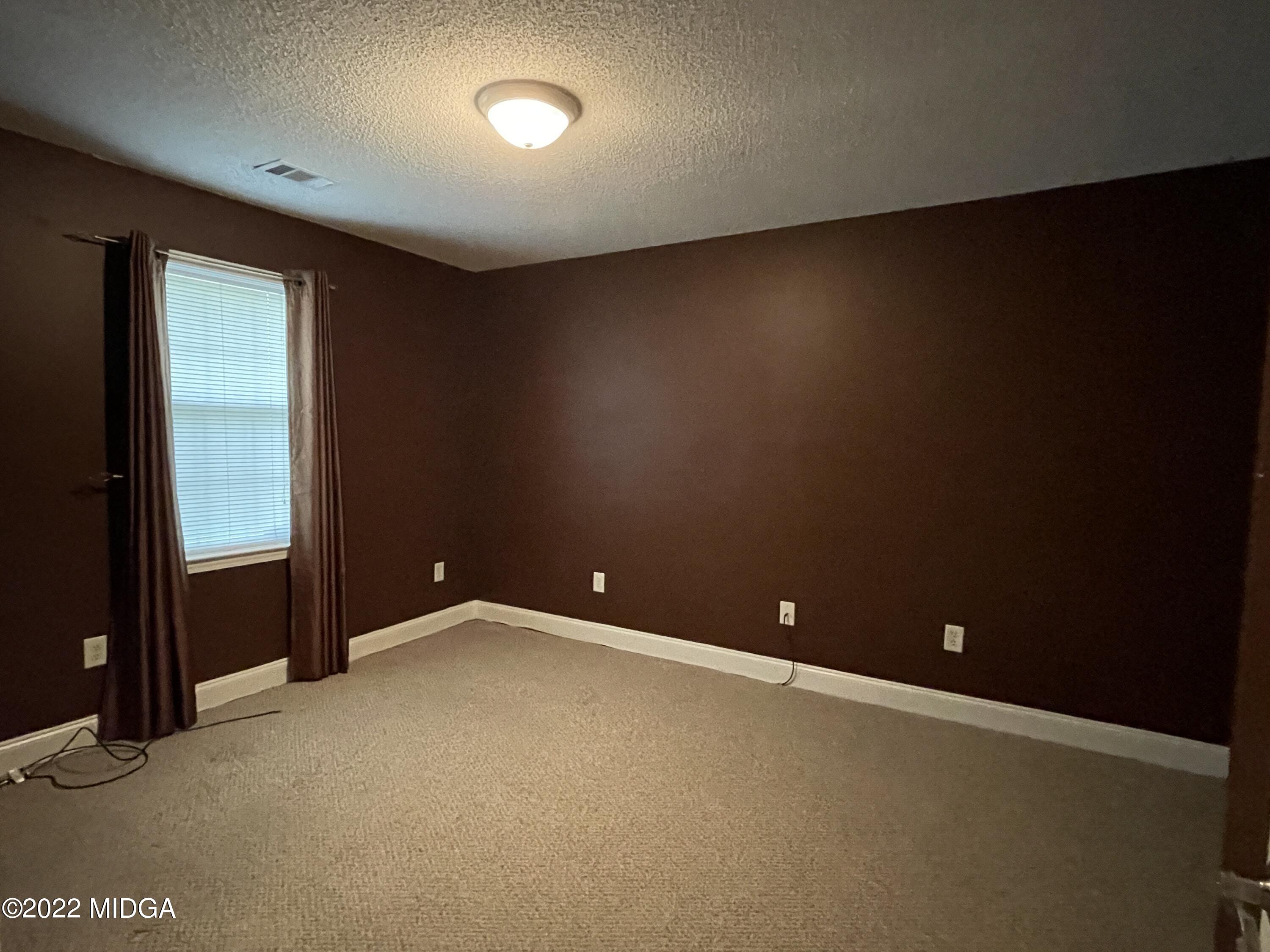 105 Carrs Station Road Sparta, GA 31087 - Photo 15 of 21 an empty room with closet area
