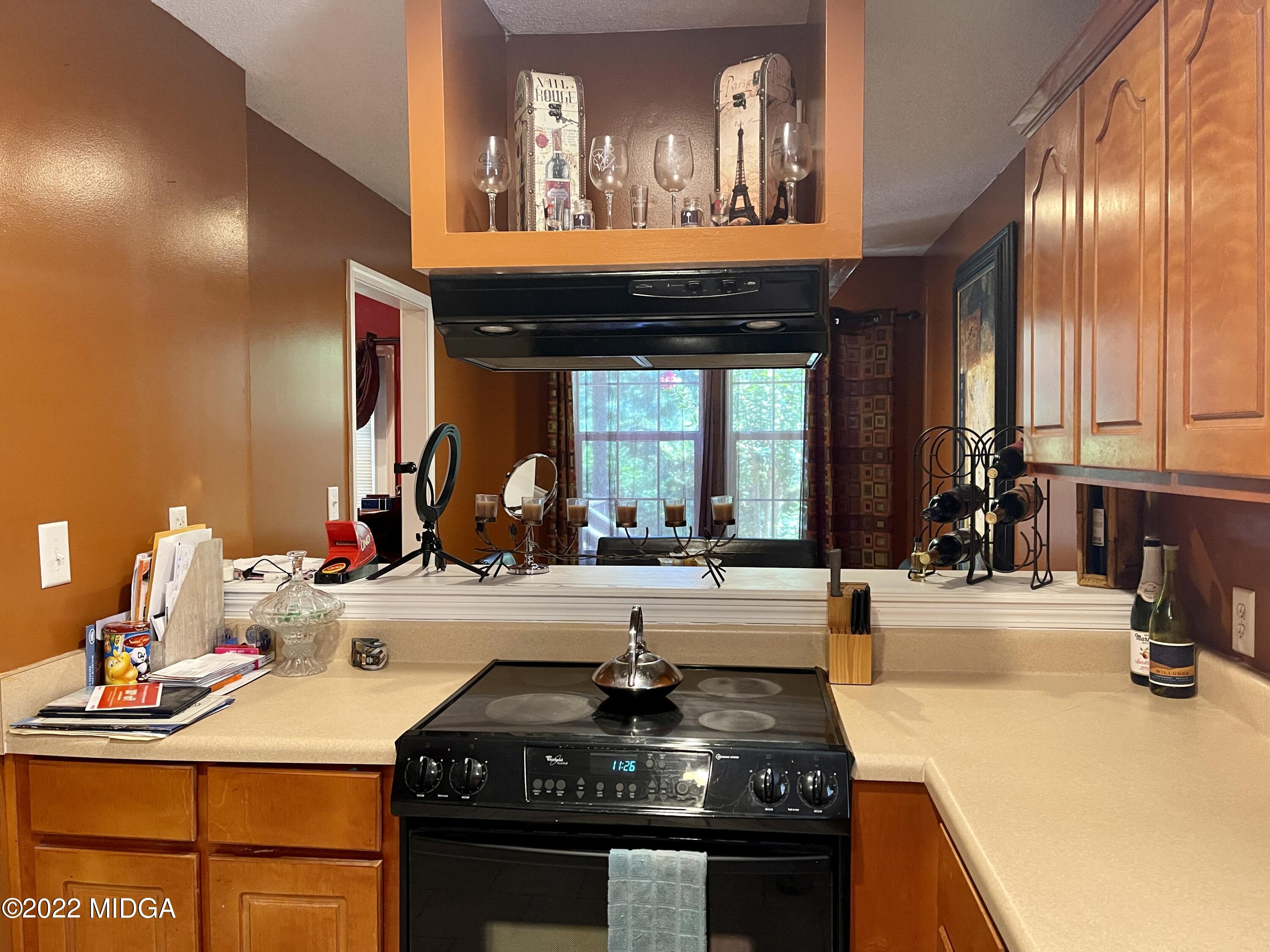 105 Carrs Station Road Sparta, GA 31087 - Photo 8 of 21 a kitchen with a stove and a sink