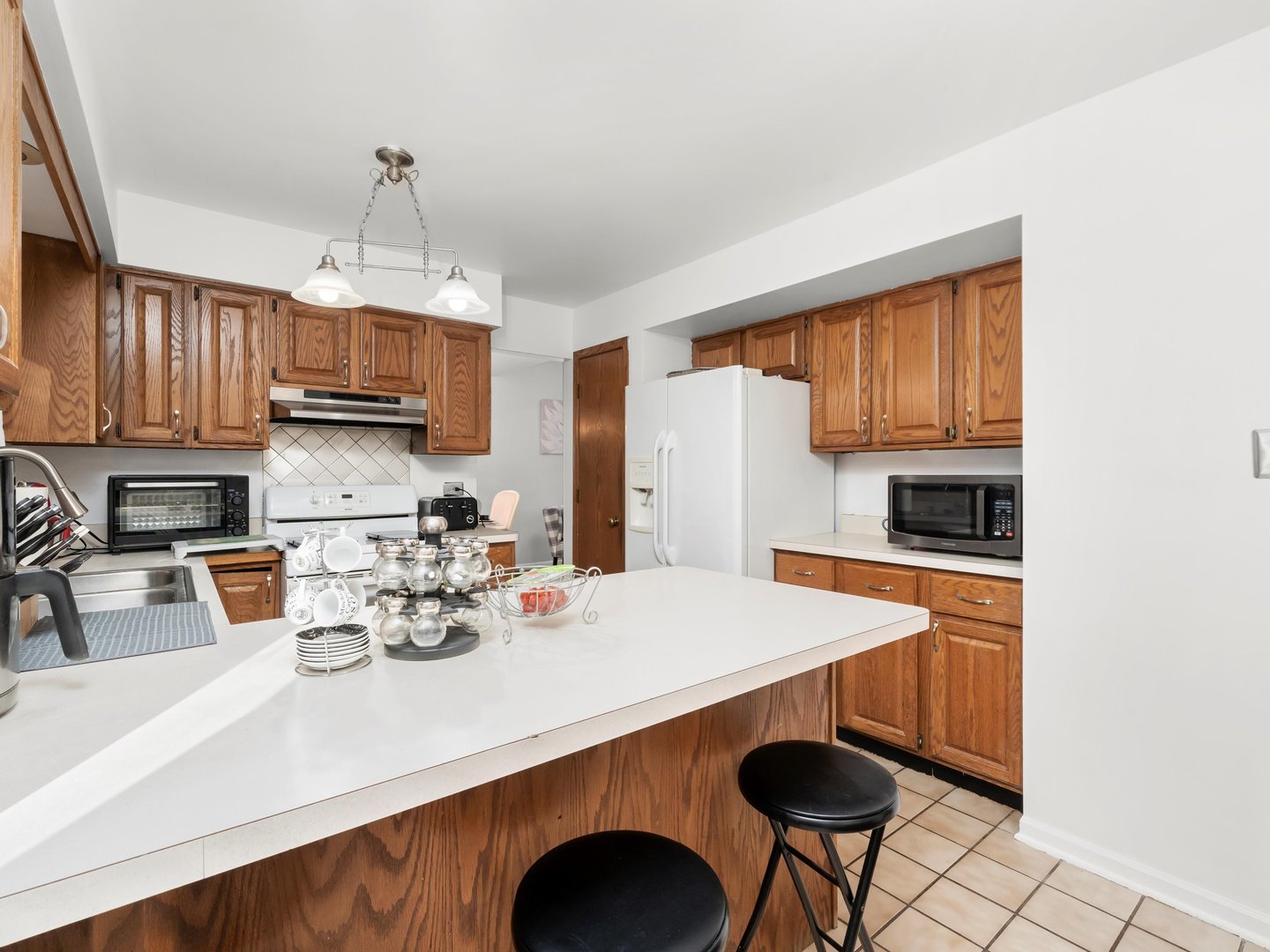 3604 Tee Court North Crete, IL 60417 - Photo 17 of 37 a kitchen with stainless steel appliances granite countertop a sink refrigerator and cabinets