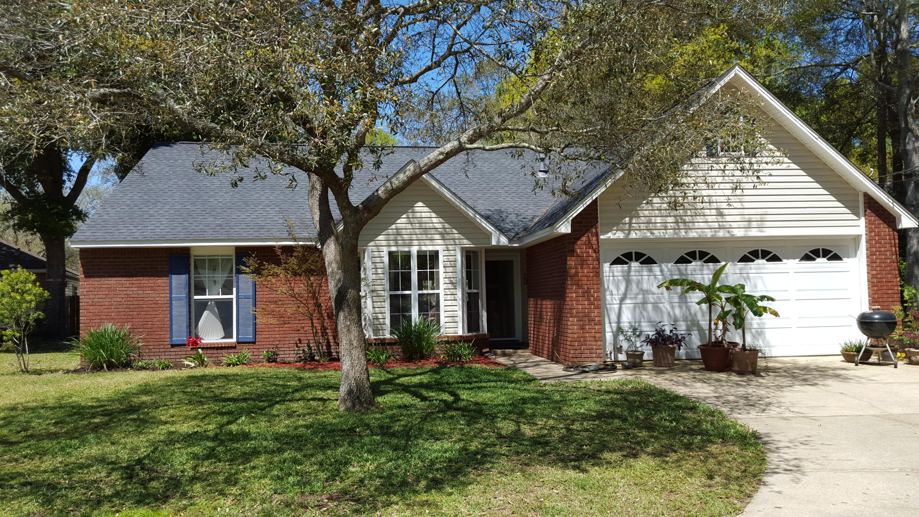 front view of a house with a yard