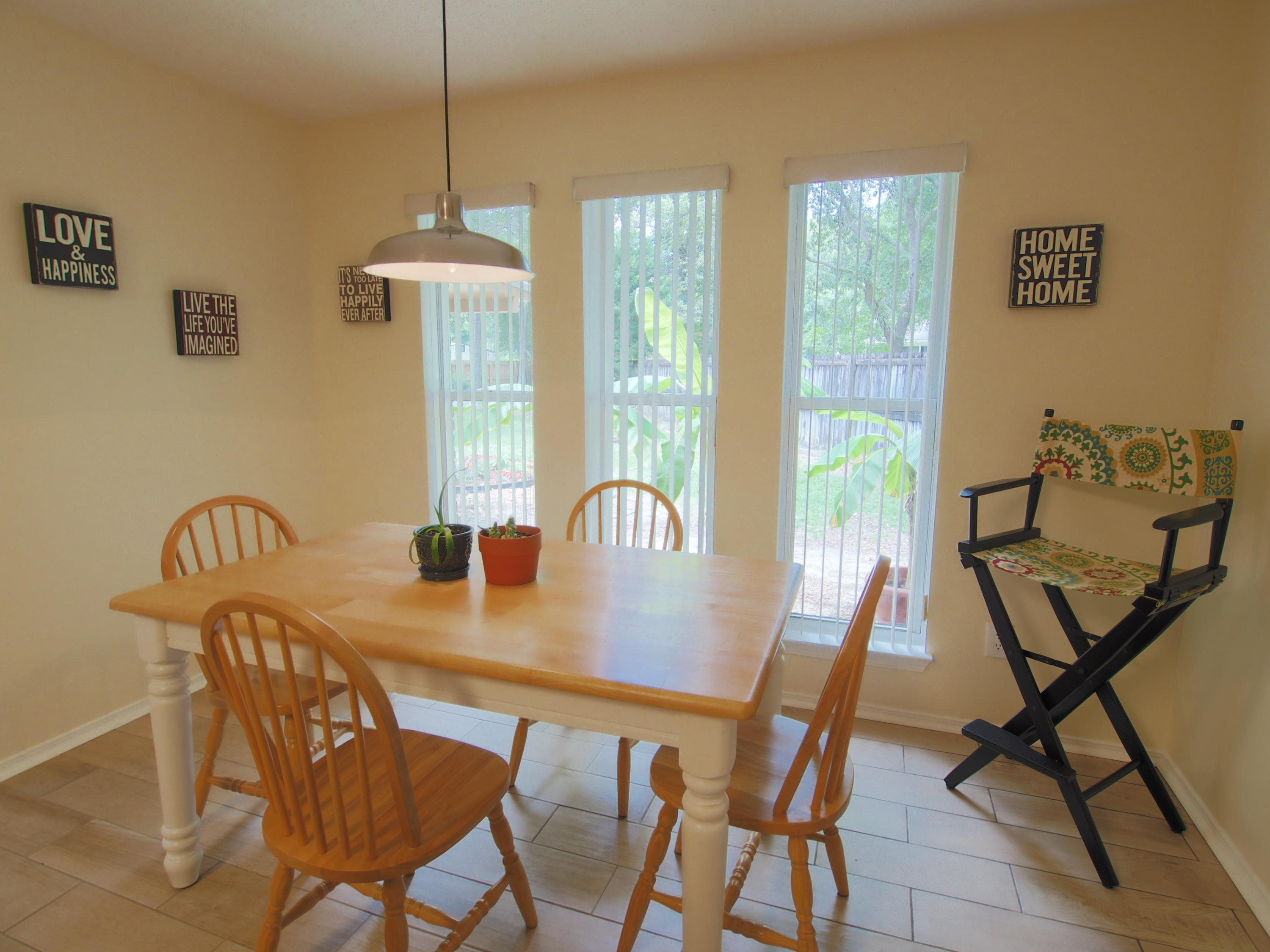 2803 Ram Lane Crestview, FL 32539 - Photo 12 of 35 a view of a dining room with furniture window and outside view