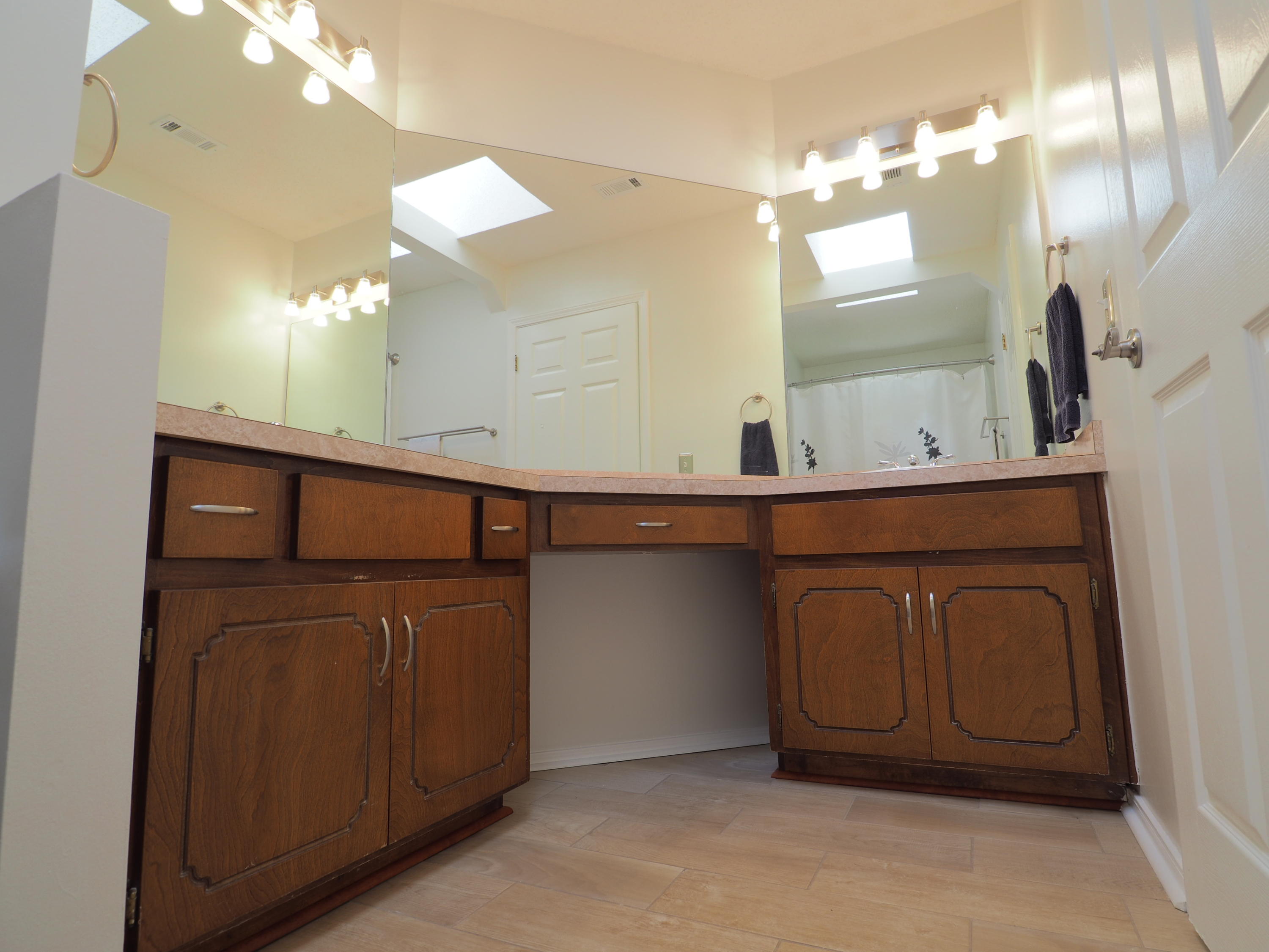 2803 Ram Lane Crestview, FL 32539 - Photo 16 of 35 a bathroom with a sink a mirror and a vanity