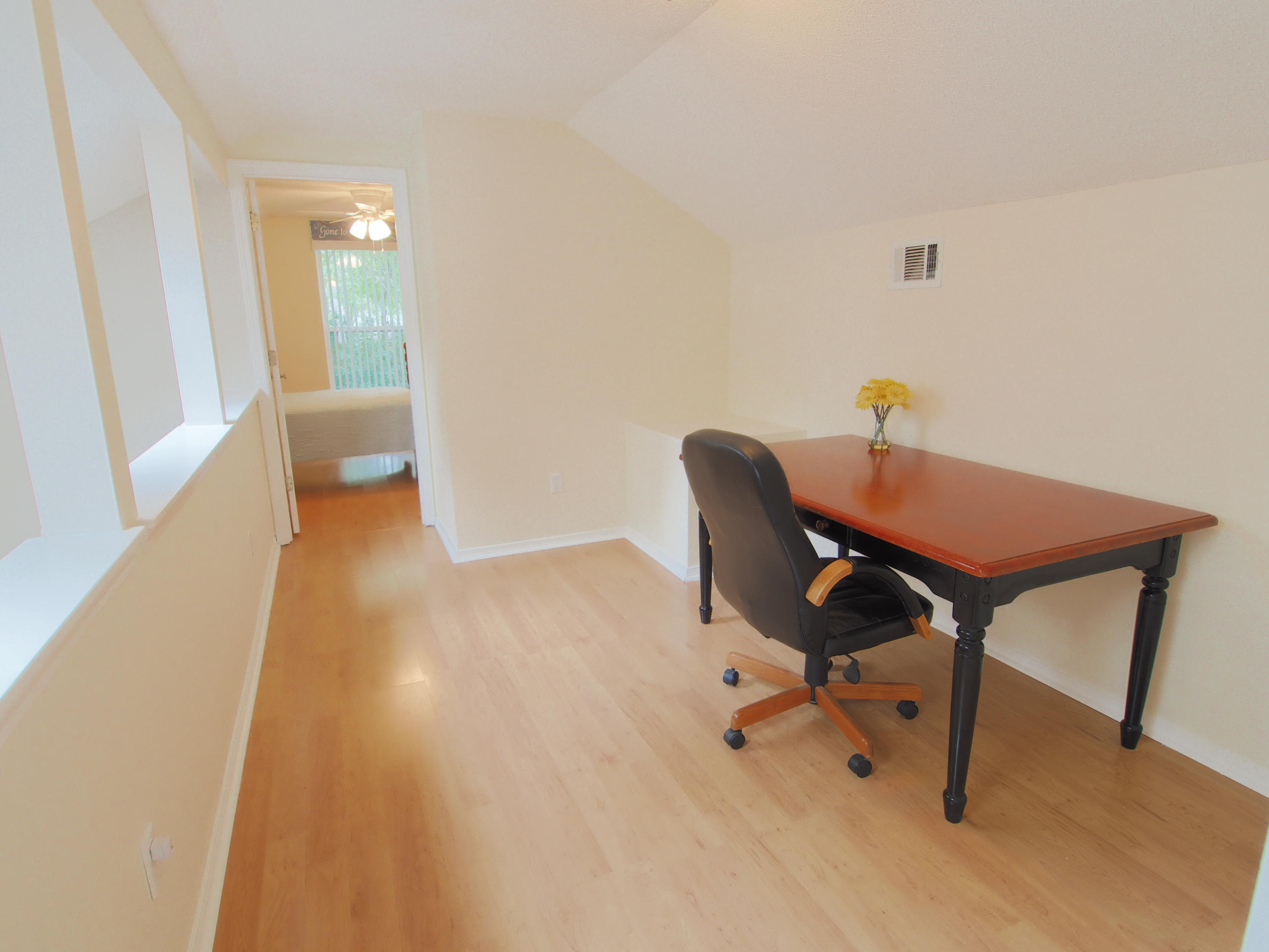 2803 Ram Lane Crestview, FL 32539 - Photo 22 of 35 a view of a workspace with furniture and wooden floor