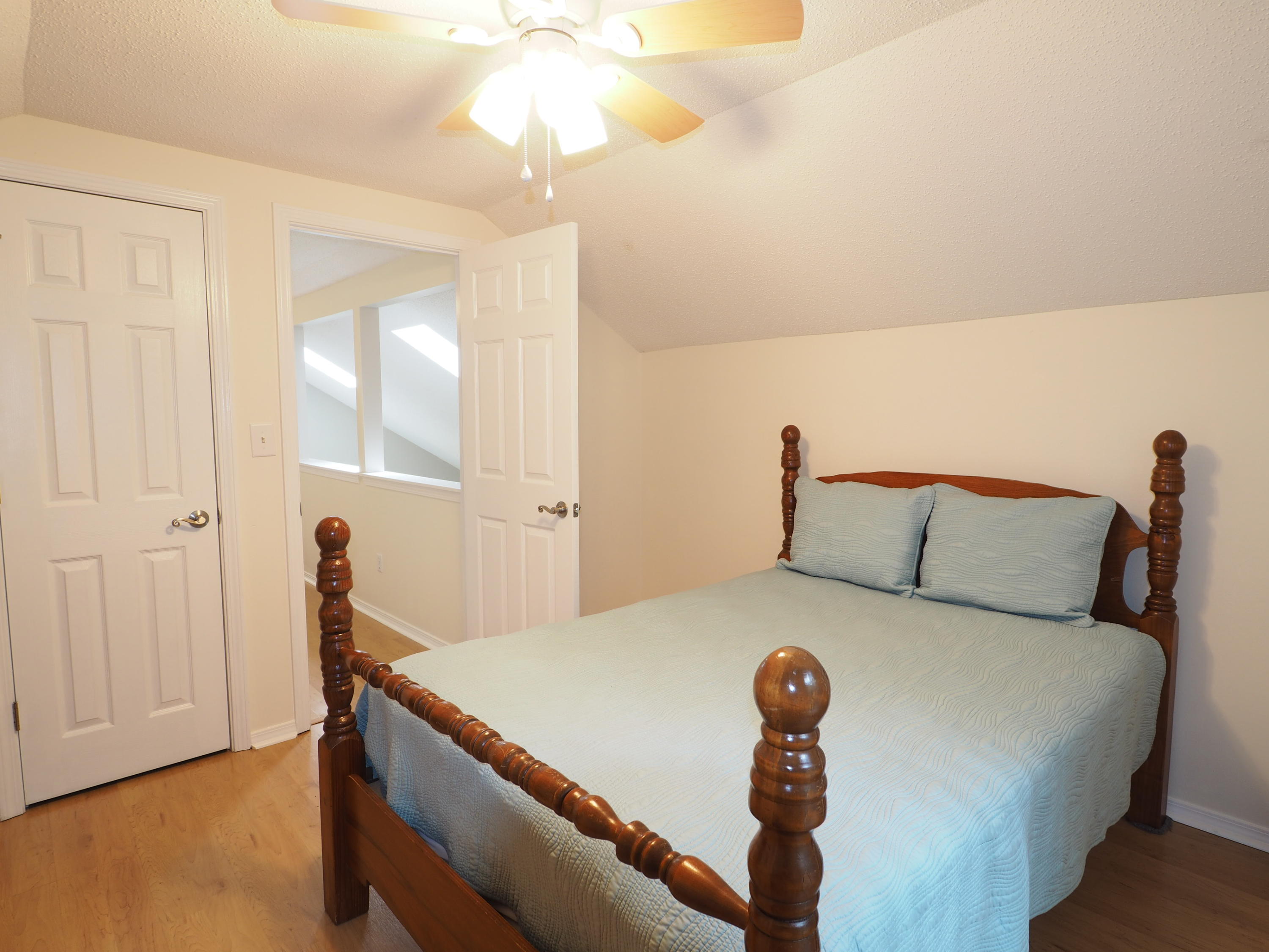 2803 Ram Lane Crestview, FL 32539 - Photo 23 of 35 a bed sitting in a bedroom next to a lamp